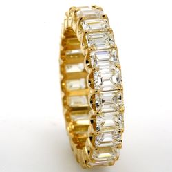Eternity band in 18K YG with U-prong set (23) emerald cut diamonds.  D3.82ct.t.w.  Size 6