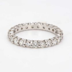 Eternity band with shared prong set (23) round diamonds.  D1.53ct.t.w.  Size 6.75