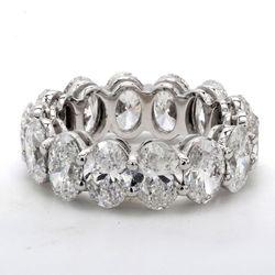 Eternity band in platinum with shared prong basket set GIA certified D-F/SI1-2 (14) oval diamonds.  D9.88ct.t.w.  Size 6.75