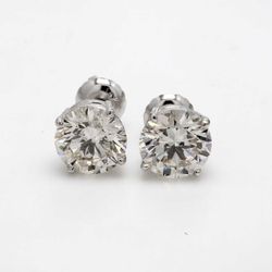 Screw back stud earrings with 4-prong basket set round diamonds.  D3.30ct.t.w.