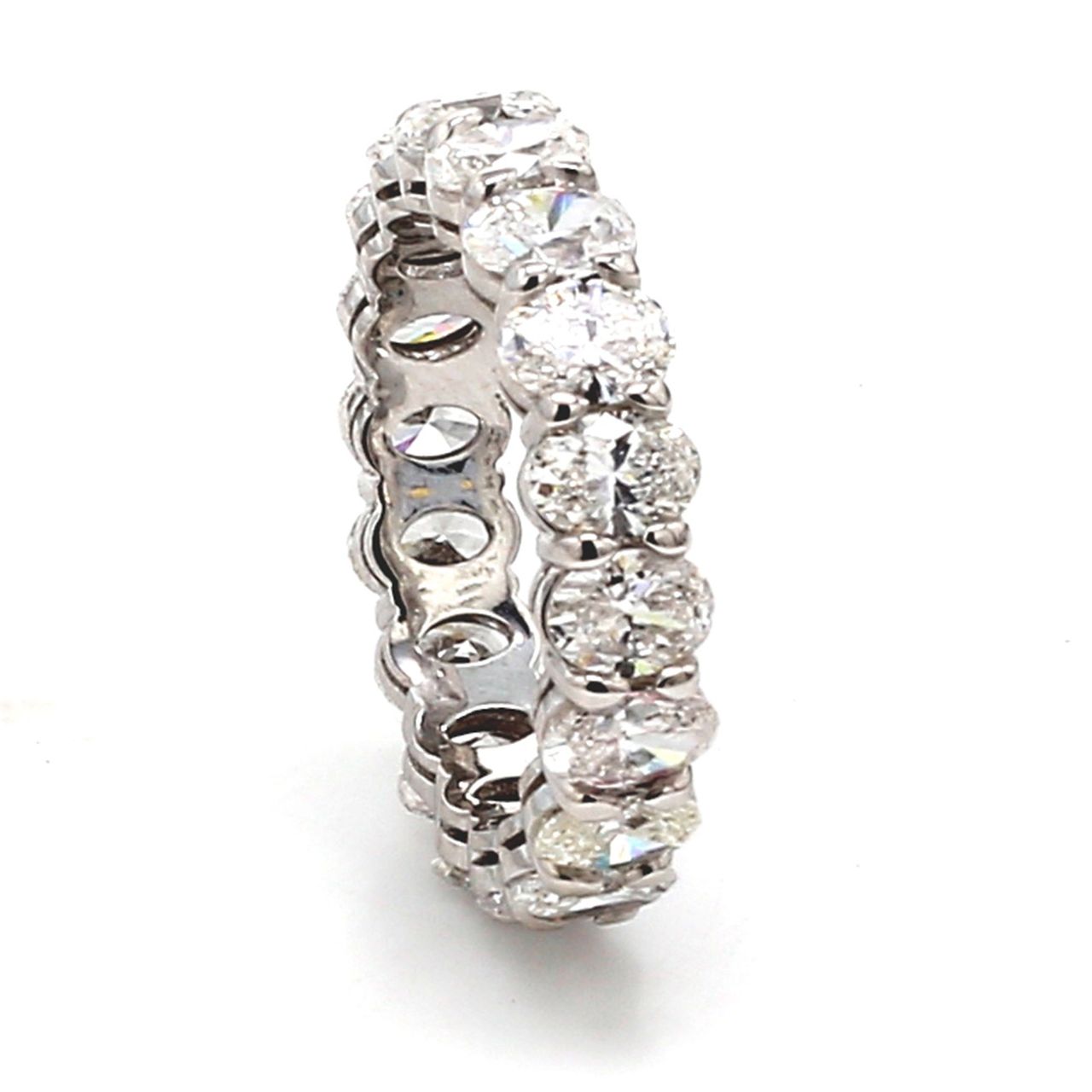 Eternity band in platinum with basket prong set (18) oval cut diamonds.  D3.35ct.t.w.  Size 4.75
