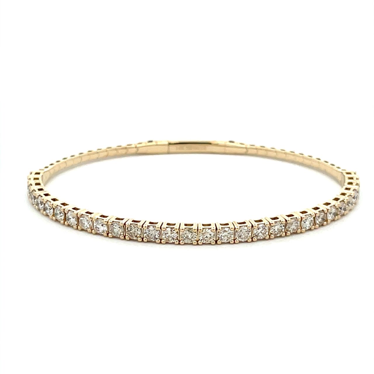 6.5' Light weight flexible oval shaped bangle in yellow gold with prong set round diamonds.  D1.85ct.t.w.