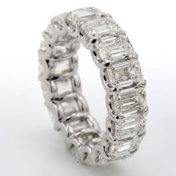 Eternity band in platinum with shared U-prong set GIA certified I/IF-VS2 (17) emerald cut diamonds.  D9.13ct.t.w.  Size 6.25
