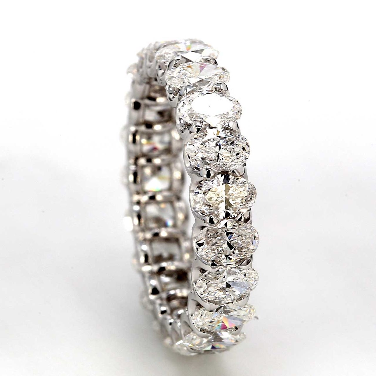 Eternity band with shared U-prong set E-F/VS+ (21) oval diamonds.  D3.26ct.t.w.  Size 5.5