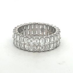 Two-row eternity band in platinum with prong set (56) emerald cut diamonds.  D4.78ct.t.w.  Size 6
