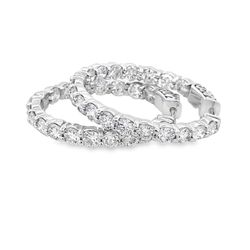 1.25' Inside out hoop earrings with prong set (36) round diamonds.  D5.33ct.t.w.