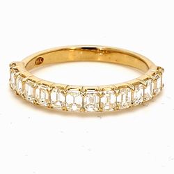 Single row band in yellow gold with prong set (14) emerald cut diamonds.  D1.23ct.t.w.  Size 6