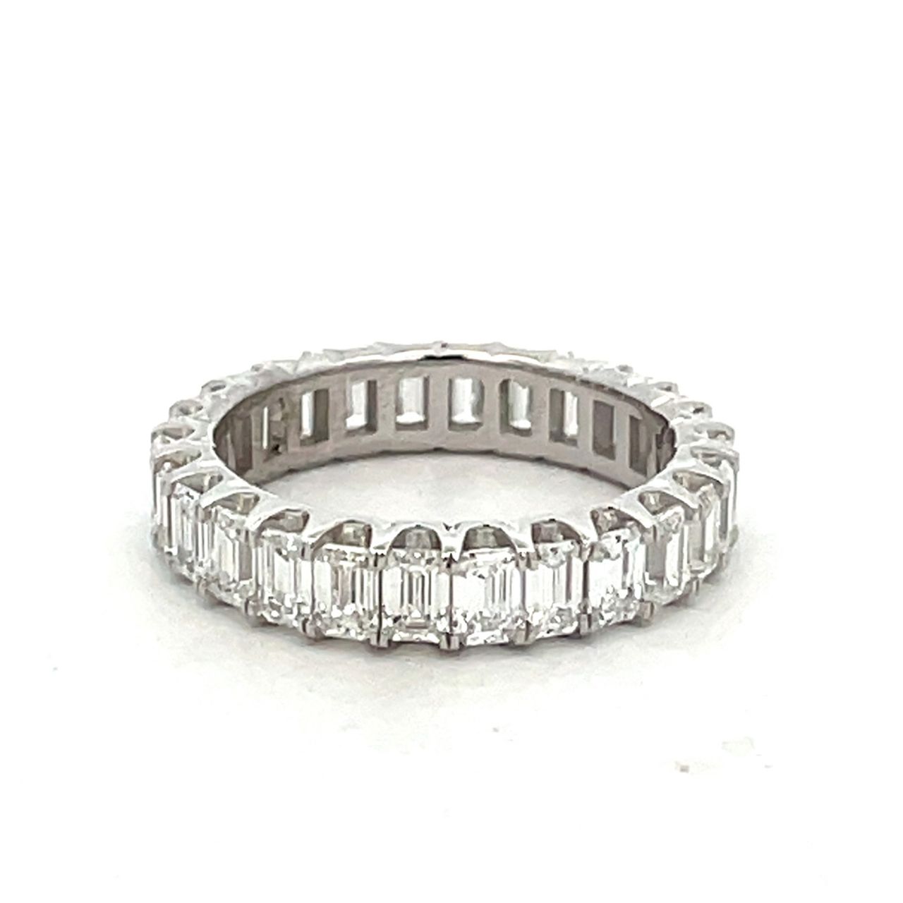Eternity band in platinum with prong set (26) emerald cut diamonds.  D2.88ct.t.w.  Size 5