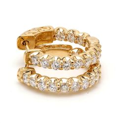 1.25' Inside out hoop earrings with prong set (36) round diamonds.  D6.73ct.t.w.