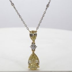 Diamonds by the yard drop necklace in 18K WG with bezel set (10) rounds and prong set FY/IF GIA certified pear diamond center.  D4.06ct.t.w.  (Center - 3.02ct.)