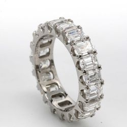 Eternity band in platinum with basket U-prong set (20) emerald cut diamonds.  D6.30ct.t.w.  Size 5