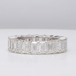 Eternity band with shared prong set (22) emerald cut diamonds.  D7.15ct.t.w.  Size 7