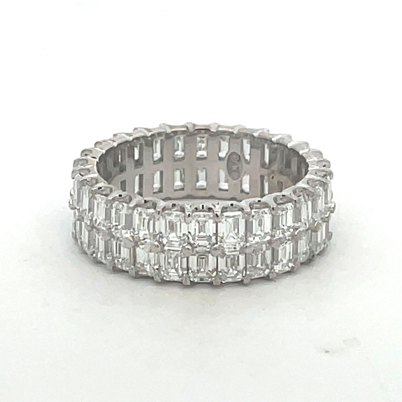 Two-row eternity band in platinum with prong set (56) emerald cut diamonds.  D4.78ct.t.w.  Size 6