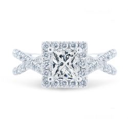 Halo criss-cross shank semi-mount with french pave set round diamonds.  D0.75ct.t.w.