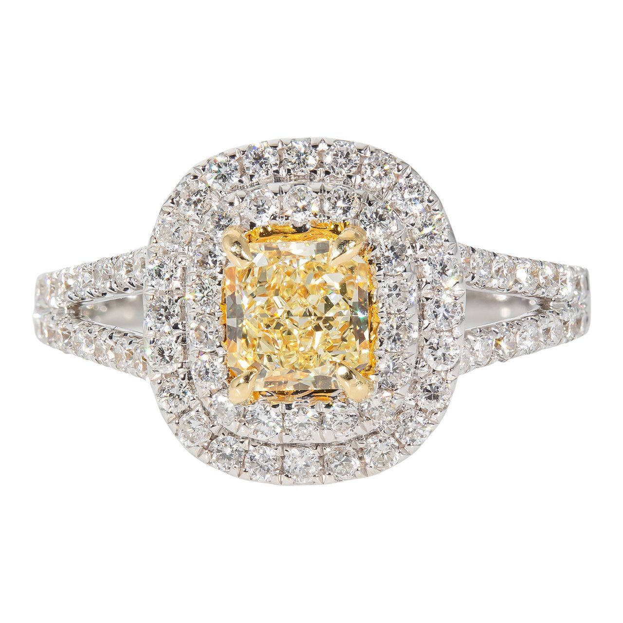 Double halo split shank ring in 18K WG with French pave set rounds around FY radiant cut diamond center stone.  D1.25ct.t.w.  (Center 0.66ct.)  Size 6.5