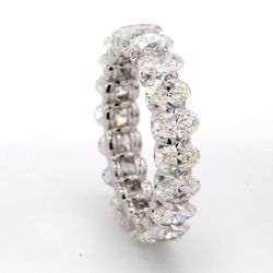 Eternity band in platinum with shared U-prong set (20) oval cut diamonds.  D3.07ct.t.w.  Size 4