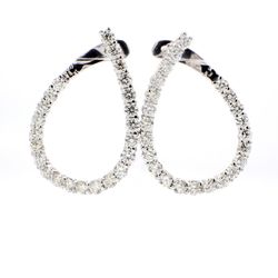 J-shaped huggy earrings with shared prong set (46) round diamonds.  D4.59ct.t.w.