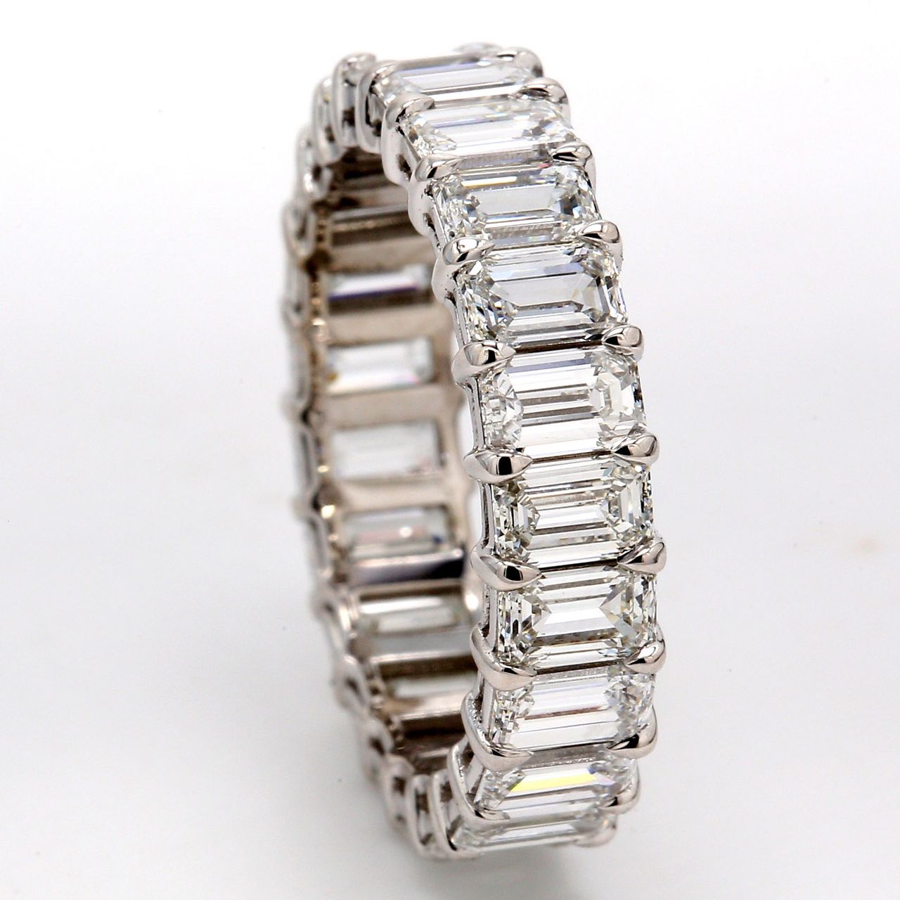 Eternity band in platinum with basket prong set (23) emerald cut diamonds.  D5.22ct.t.w.  Size 7