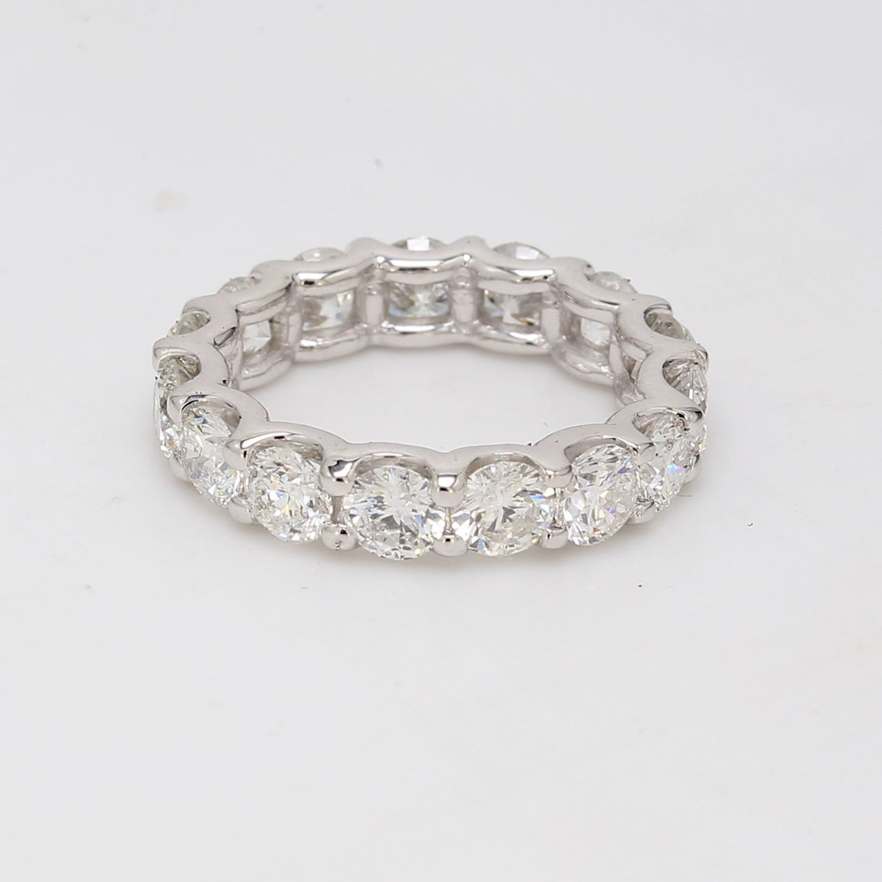 Eternity band with shared U-prong set round diamonds.  D3.88ct.t.w.  Size 4.5