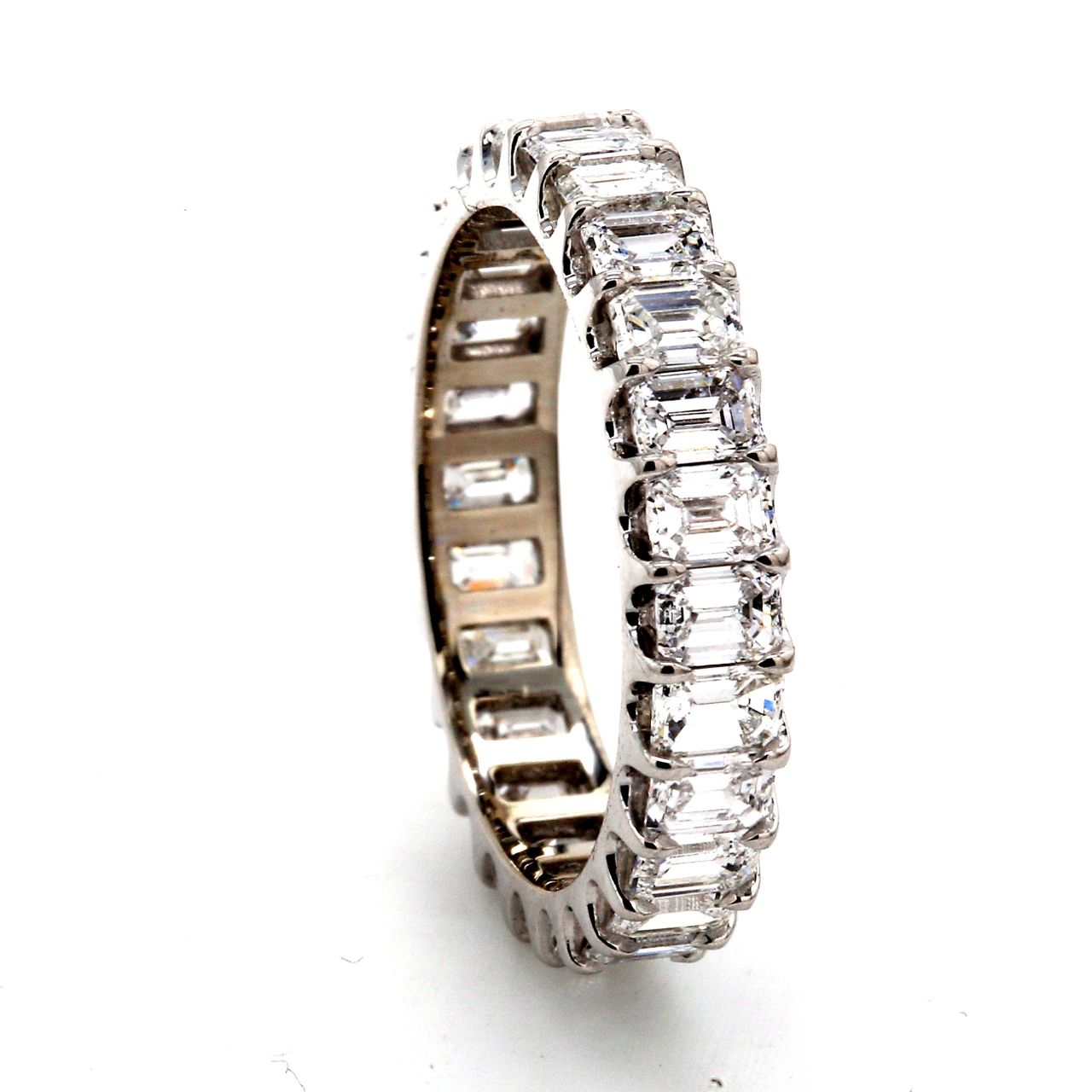 Eternity band in platinum with U-prong set (26) emerald cut diamonds.  D2.67ct.t.w.  Size 5.5