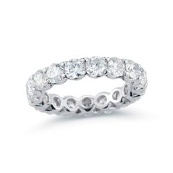 Eternity band in platinum with shared prong set GIA certified E-F/VS1-VS2 (13) round diamonds.  D9.10ct.t.w.  Size 6.5