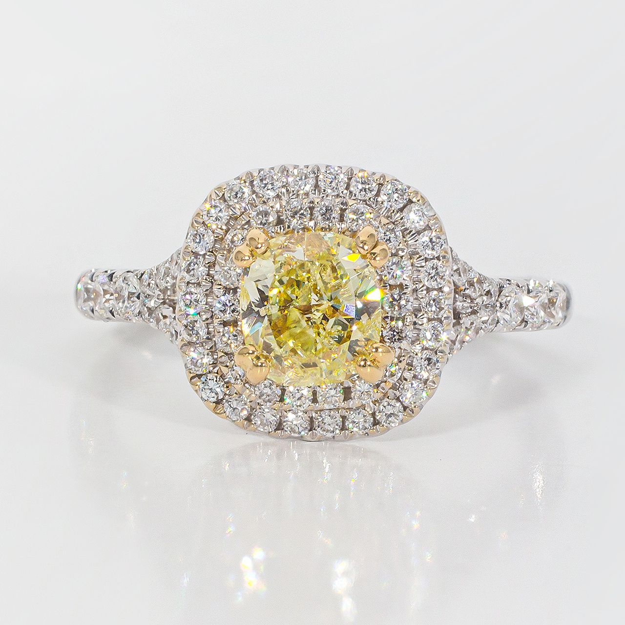 Double halo split shank ring in 18K WG with prong set rounds around FY cushion cut diamond center stone.  D1.49ct.t.w.  (Center 1.00ct.)