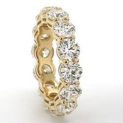 Eternity band in 18K YG with basket prong set round diamonds.  D7.03ct.t.w.  Size 7
