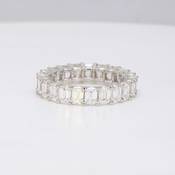Eternity band in 18K WG with U-prong set emerald cut diamonds.  D3.38ct.t.w.  Size 4.25