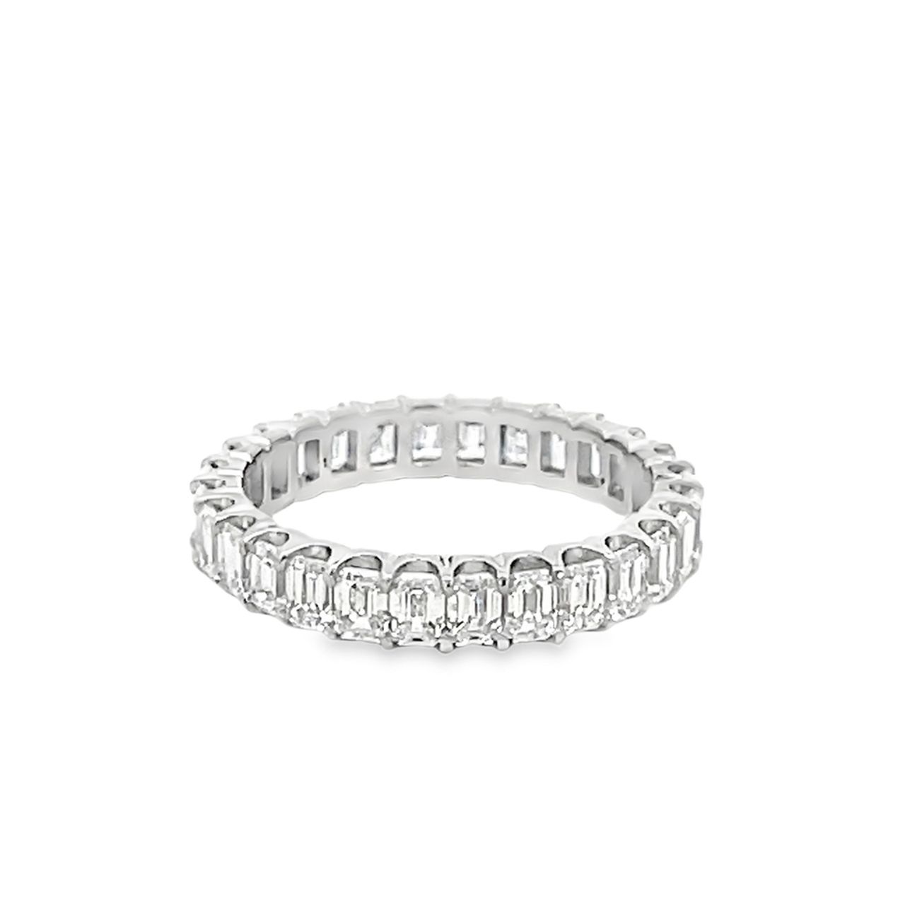 Eternity band in platinum with shared U-prong set (28) emerald cut diamonds.  D2.18ct.t.w.  Size 5