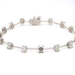 7' Tennis bracelet in platinum w/ alternating oval & emerald cut diamonds.  D3.87ct.t.w.