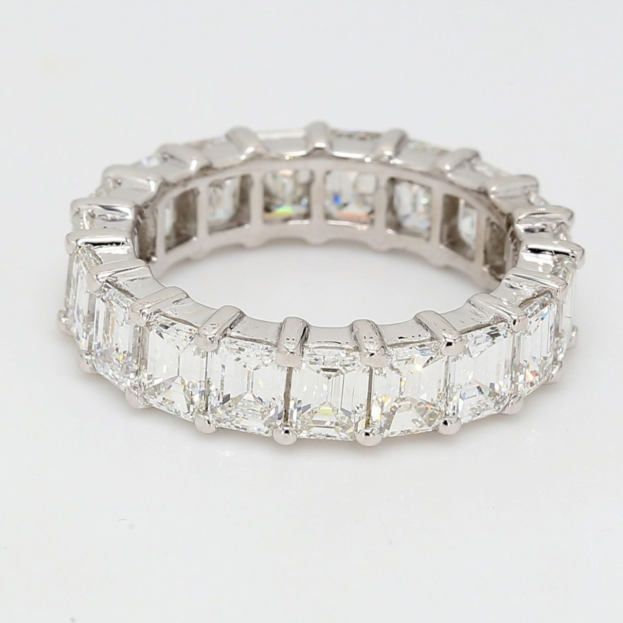Eternity band in platinum with basket shared prong set emerald cut diamonds.  D5.80ct.t.w.  Size 6.5