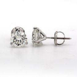 Screw back martini style stud earrings with prong set USA certified D-E/SI3-I1  round diamonds.  D2.34ct.t.w.