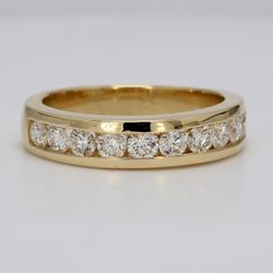Ring in yellow gold with channel set round diamonds.  D1.25ct.t.w.  Size 9.75