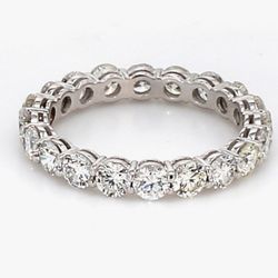 Eternity band in 18K WG w/ basket prong set (20) round diamonds.  D1.84ct.t.w.  Size 4.75