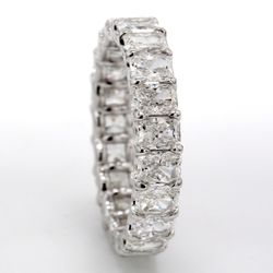 Eternity band in platinum with shared U-prong set (21) radiant cut diamonds.  D5.19ct.t.w.  Size 8