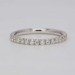 Eternity band in 18K WG with french pave set round diamonds.  D0.59ct.t.w.  Size 5
