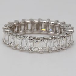 Eternity band with U-prong set (23) emerald cut diamonds.  D4.74ct.t.w.  Size 6.75