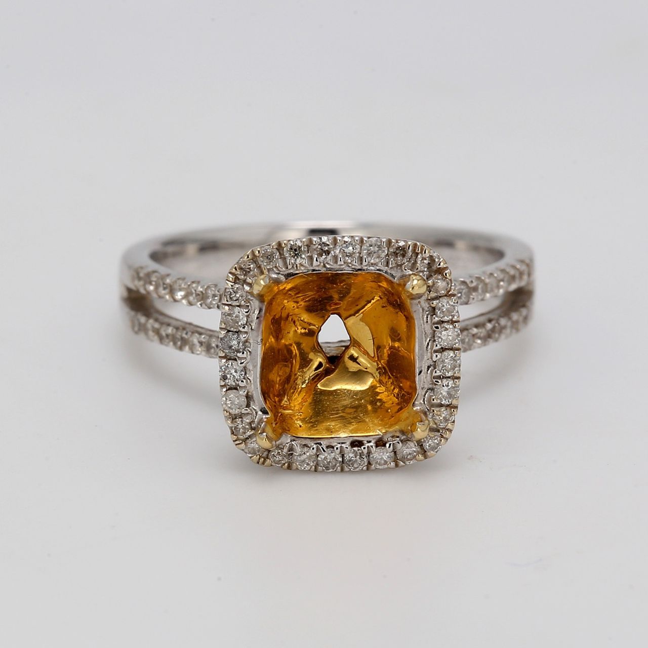 Halo semi-mount in 18K WG with french pave set round diamonds.  D0.60ct.t.w.