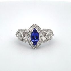 Antique style ring in platinum with round & marquise diamonds and a 4-prong set marquise shaped tanzanite center.  D1.25ct.t.w. (Tanzanite - 1.10ct.)