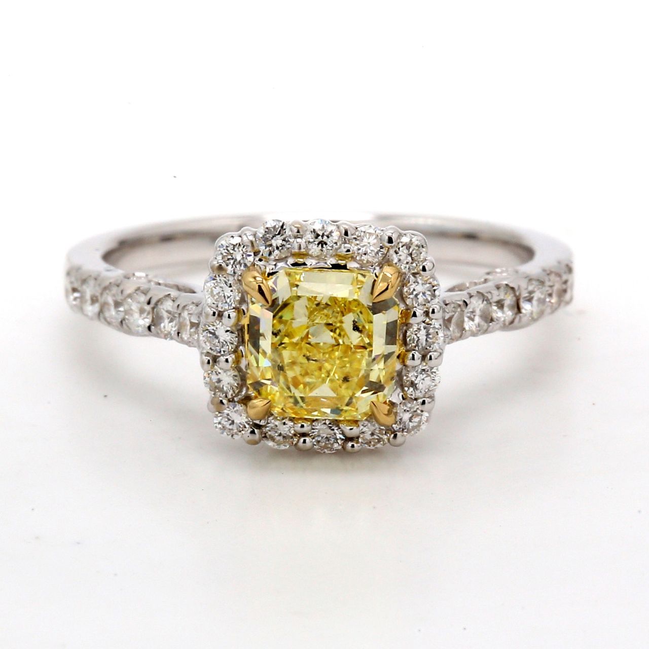 Halo fleur-de-lis style ring in 18K WG with French pave set rounds around 4-prong set GIA certified FIY/I1 radiant diamond centerstone.  D1.50ct.t.w.  (Center 1.02ct.)