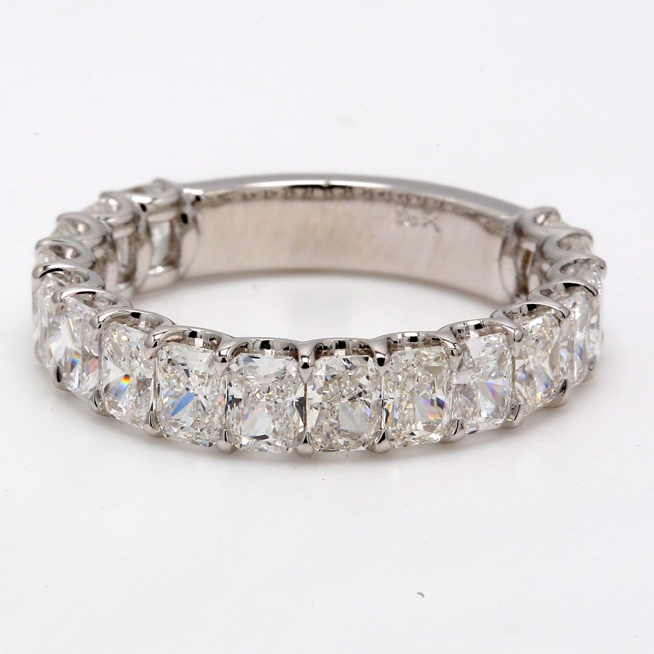 Band in 18K WG with U-prong set (17) radiant cut diamonds.  D4.31ct.t.w.  Size 8.75