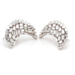 French clip earrings in half moon shape with baguette prong set diamonds in free style design.  D4.18ct.t.w.