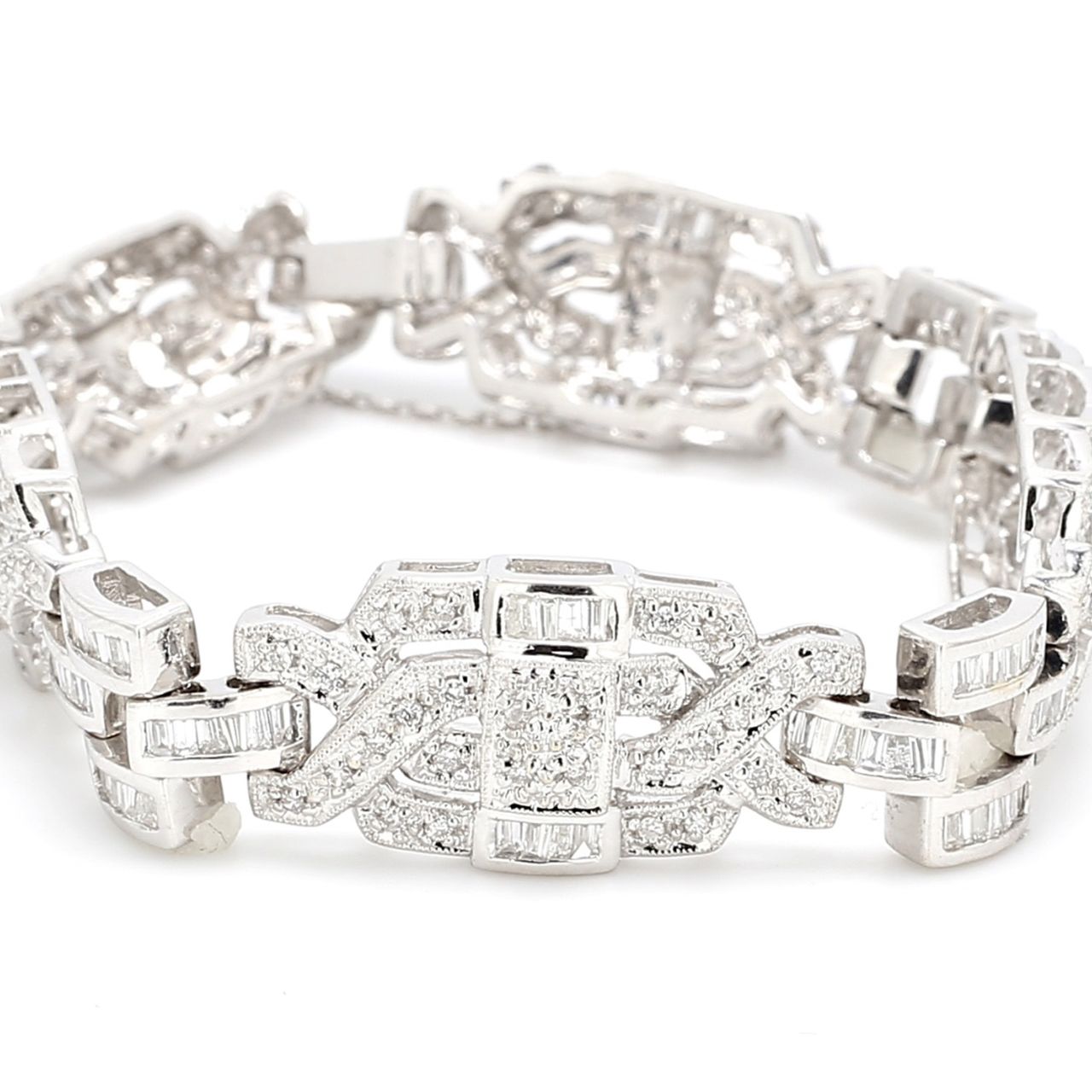 Antique style bracelet in 18K WG with round & baguette diamonds.  D4.30ct.t.w.