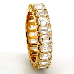 Eternity band in 18K YG with U-prong set (22) emerald cut diamonds.  D4.80ct.t.w.  Size 6