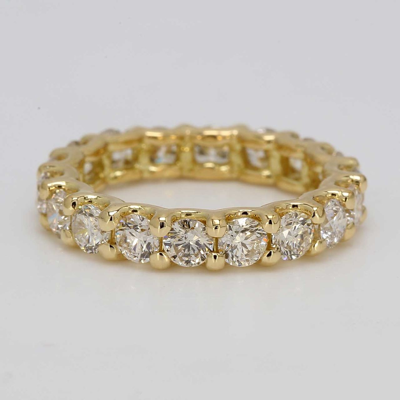 Eternity band in 18K YG with U-prong set round diamonds.  D3.33ct.t.w.  Size 7.5