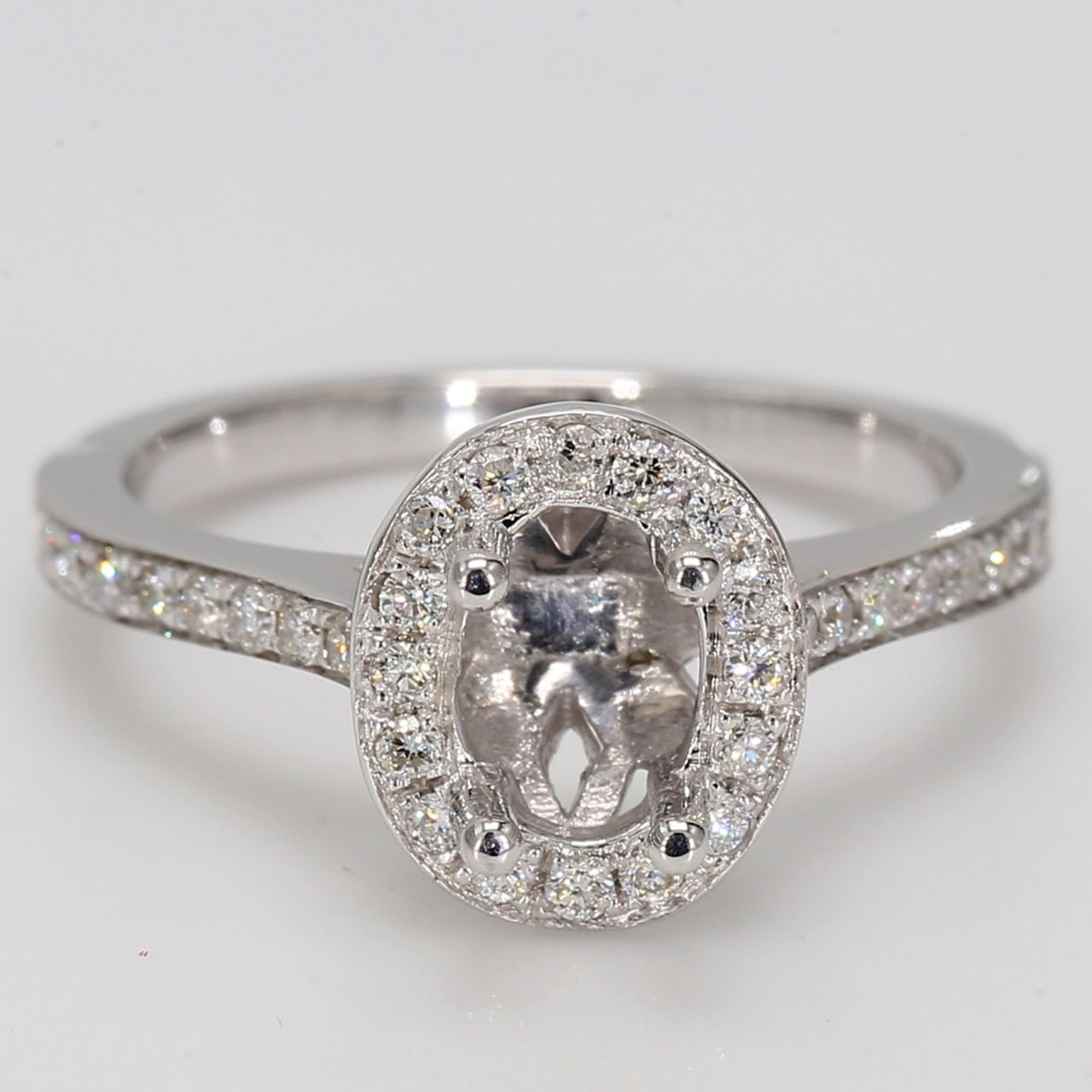 Halo semi-mount with shared prong round diamonds.  D0.42ct.t.w.