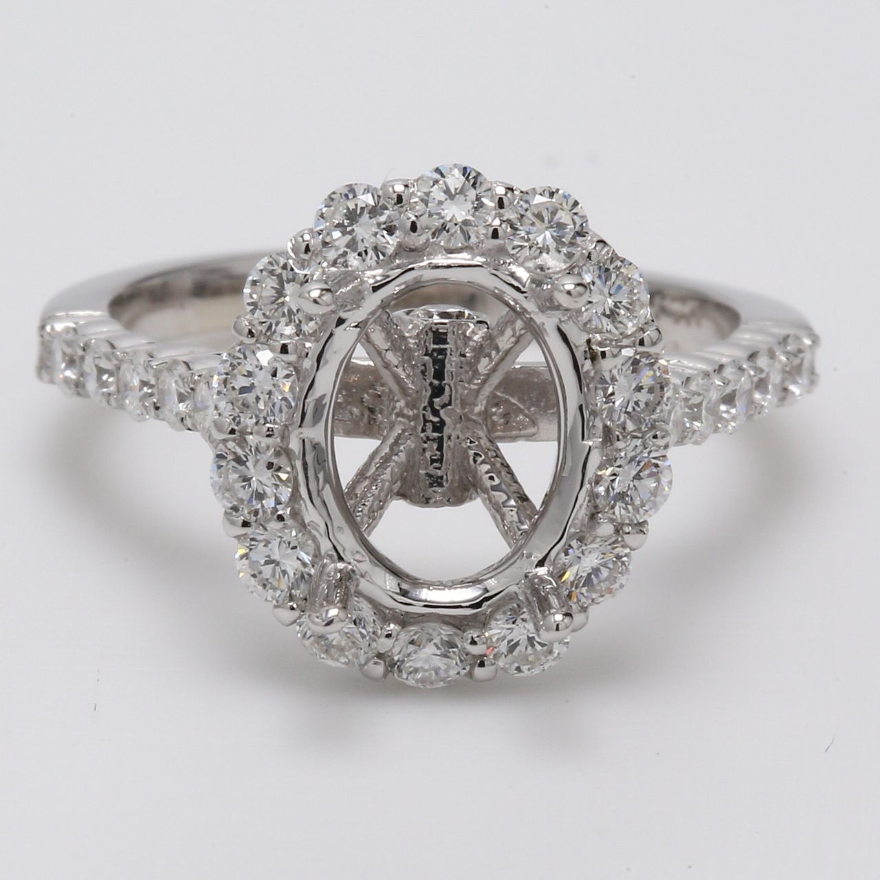Halo semi-mount with shared prong set round diamonds.  D0.99ct.t.w.