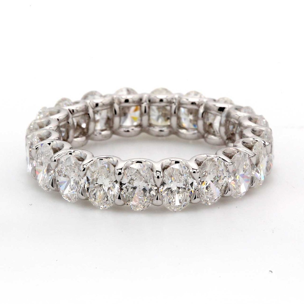Eternity band in platinum with U-prong set (19) oval diamonds.  D3.73ct.t.w.  Size 5