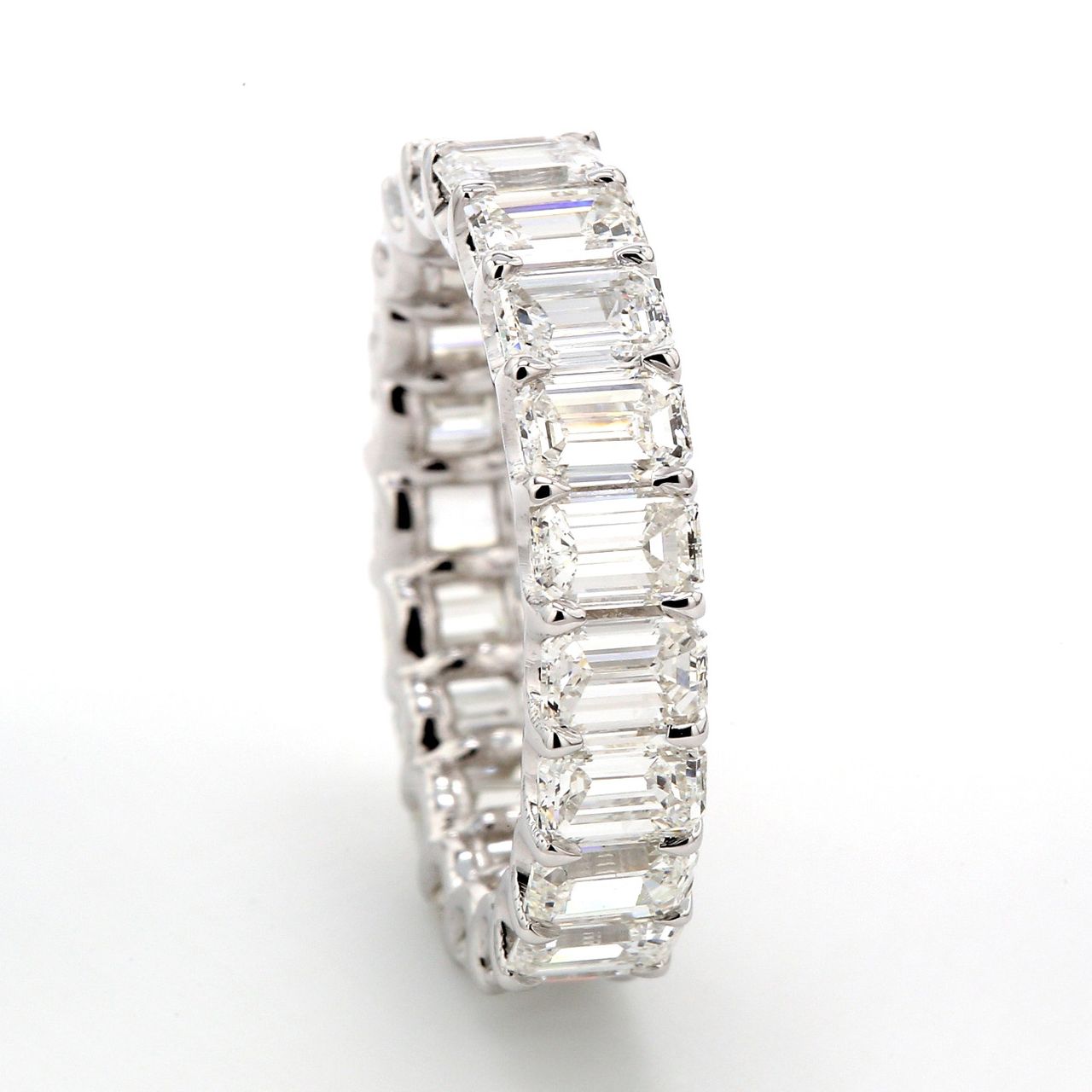 Eternity band with shared claw U-prong set (22) emerald cut diamonds.  D4.32ct.t.w.  Size 4.5