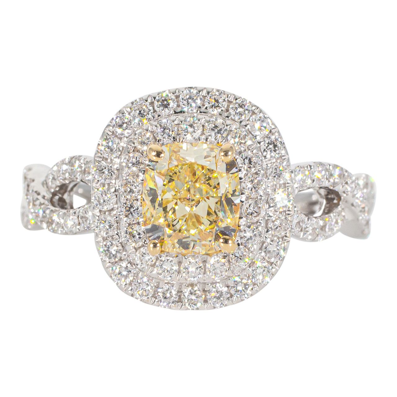 Double halo criss cross shank ring in 18K WG with rounds around a FY cushion cut diamond center stone.  D1.68ct.t.w.  (Center 1.08ct.)  Size 6.75